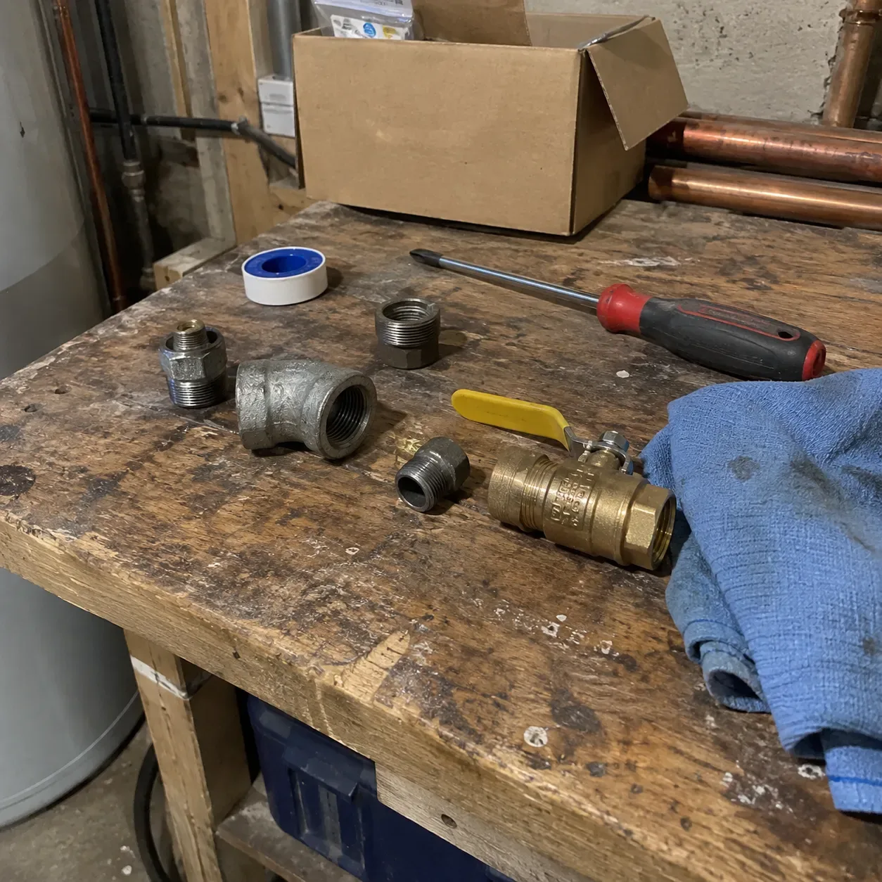 Technician holding a replacement component for a residential boiler